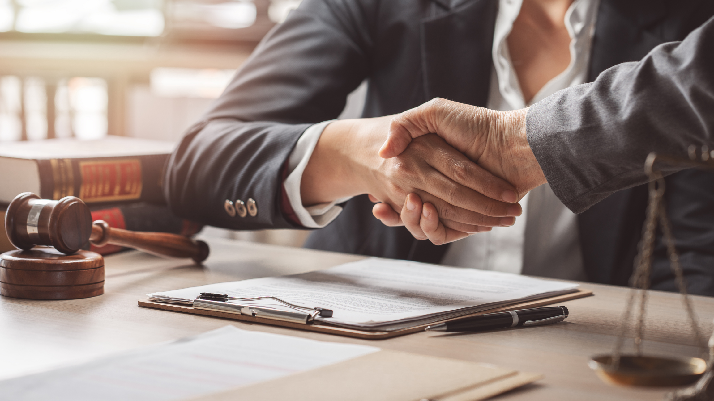 lawyer client handshake