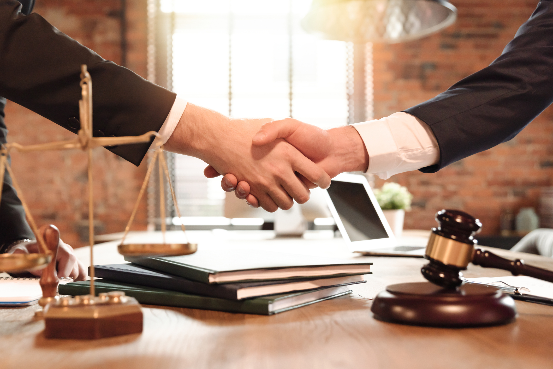 lawyer client handshake